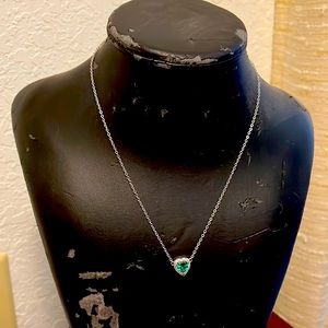 Heart pendant necklace with emerald and diamond like on a silver chain